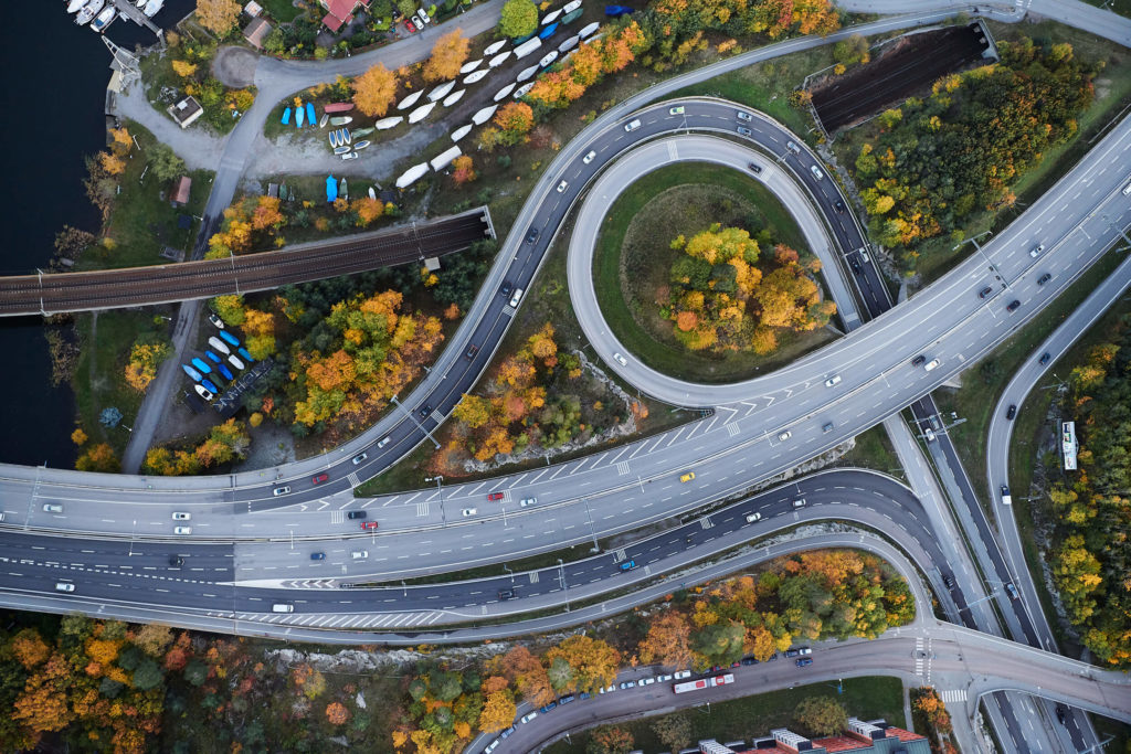 Aerial shot of a complex road system and moving cars